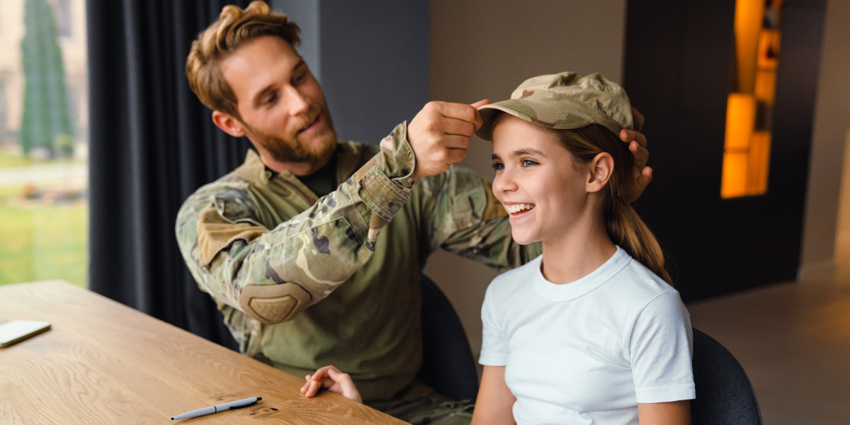 Vet Placing Hat on Daughter